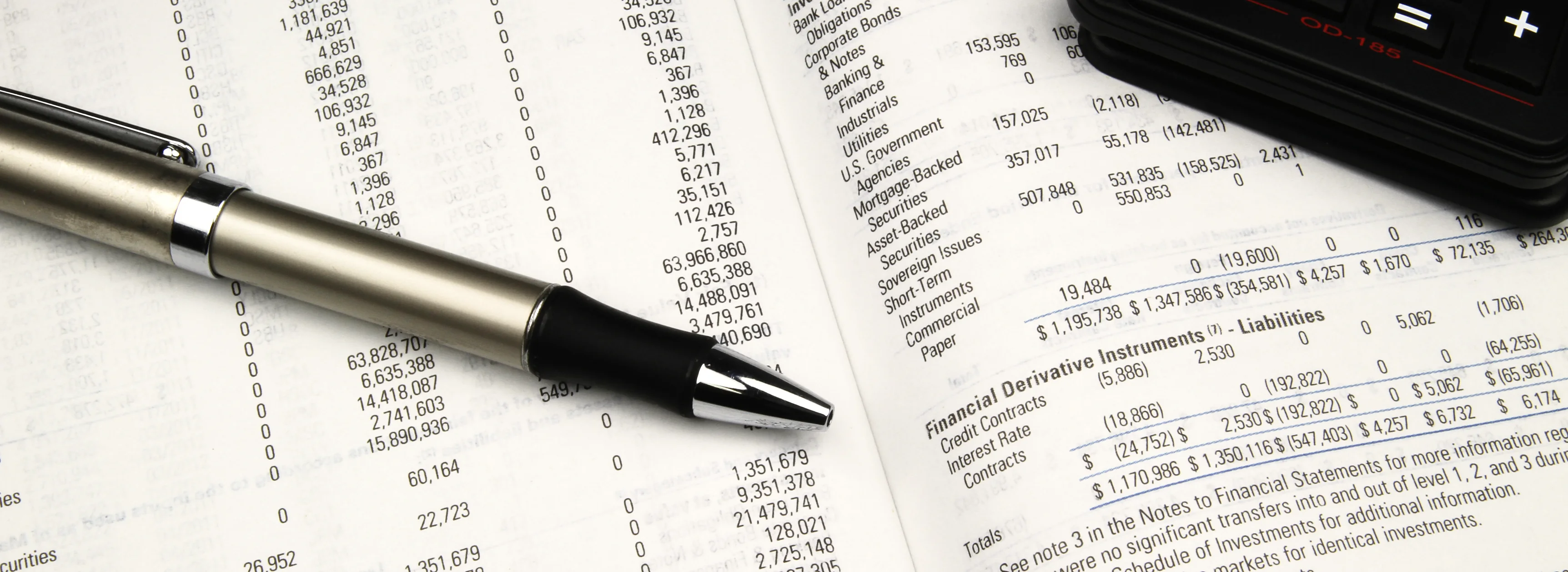 A pen resting on a printed fund prospectus
