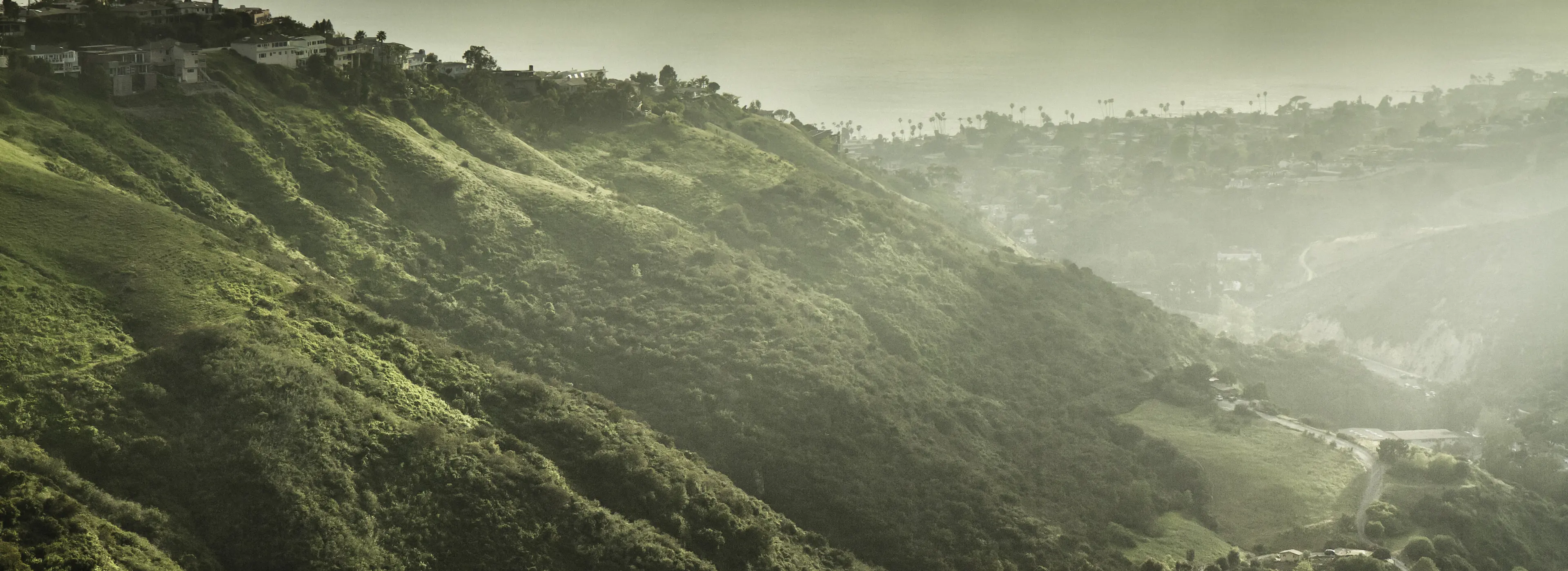 Morning haze lifting off the canyon hills above Laguna Beach